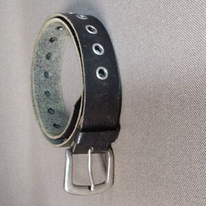 Weathered silver grommet belt